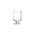 Clear glass hurricane-style votive holder with pedestal base and cylindrical body.