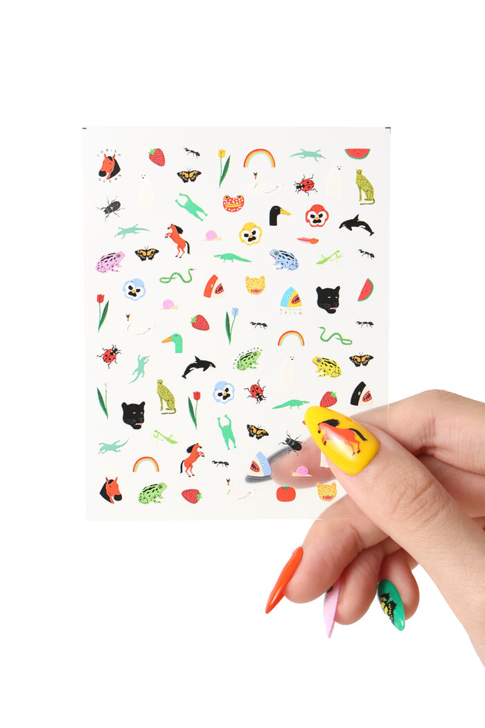 Sheet of Lorien Stern Natural World nail stickers with diverse animal and nature designs.
