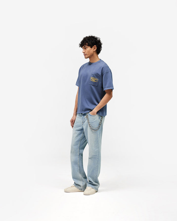 Represent Nothing Faster T-Shirt in Indigo, featuring a chest patch pocket and vintage distressed finish.