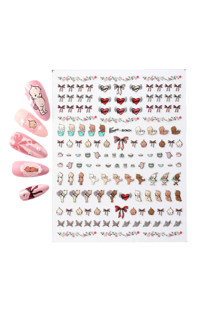 Sheet of Onch x Kewpie nail stickers featuring cute baby illustrations, bows, hearts, and floral borders.