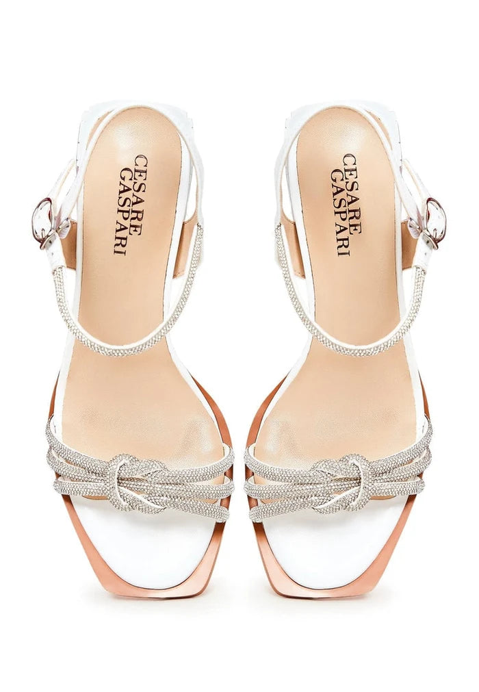 A trendy pair of white Alisa sandals with open toe design and block heels, perfect for any occasion.