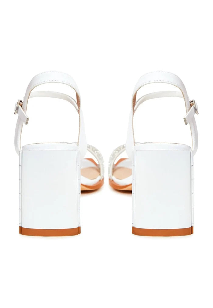 A stylish pair of Alisa open-toe block heel sandals in white, the perfect addition to any outfit for a touch of elegance and comfort.