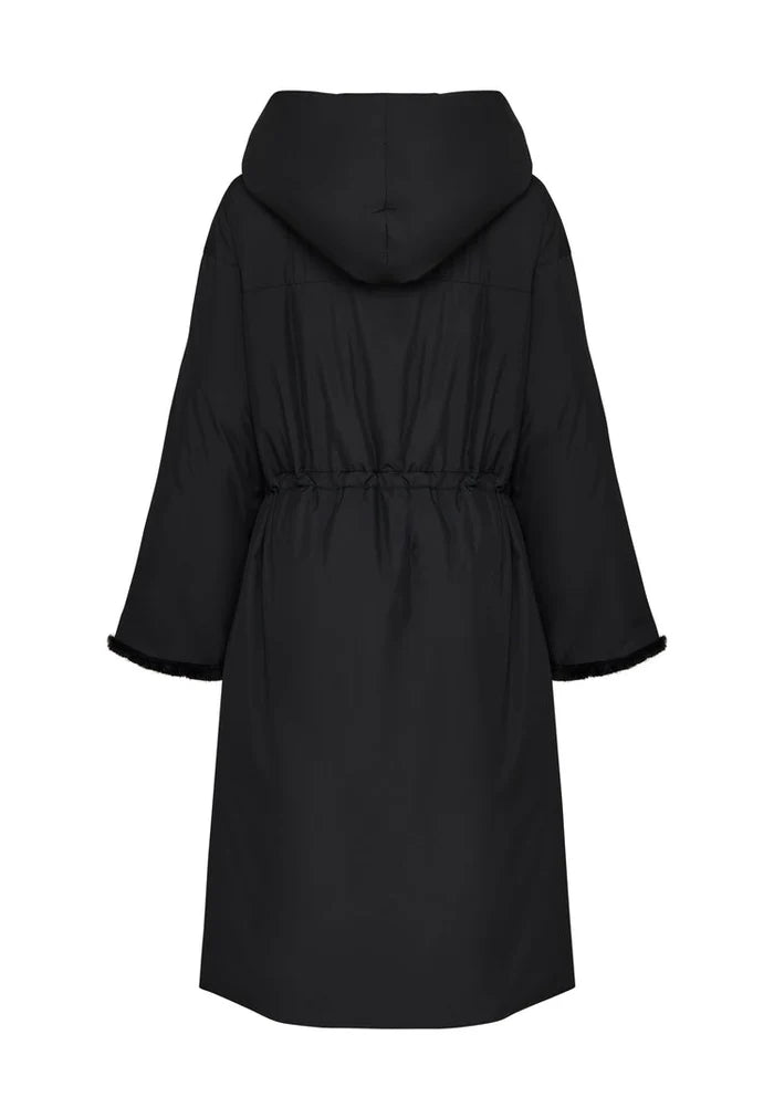 A stylish black oversized puffer coat with a hood and faux fur cuffs, perfect for winter. This plus size women's fashion jacket is an essential for staying warm and stylish.
