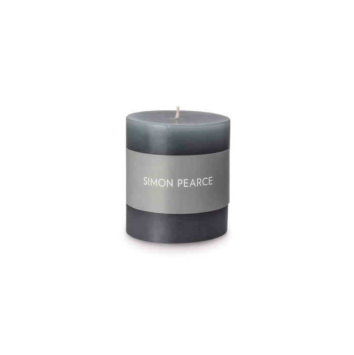 Pewter-gray pillar candle with cream band label and single wick.