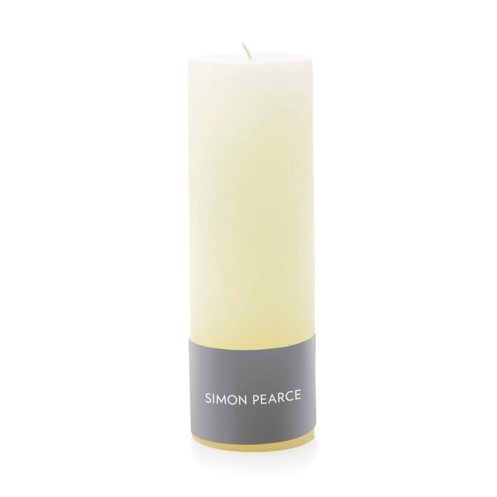 Ivory pillar candle with gray band label and cream-colored wick.