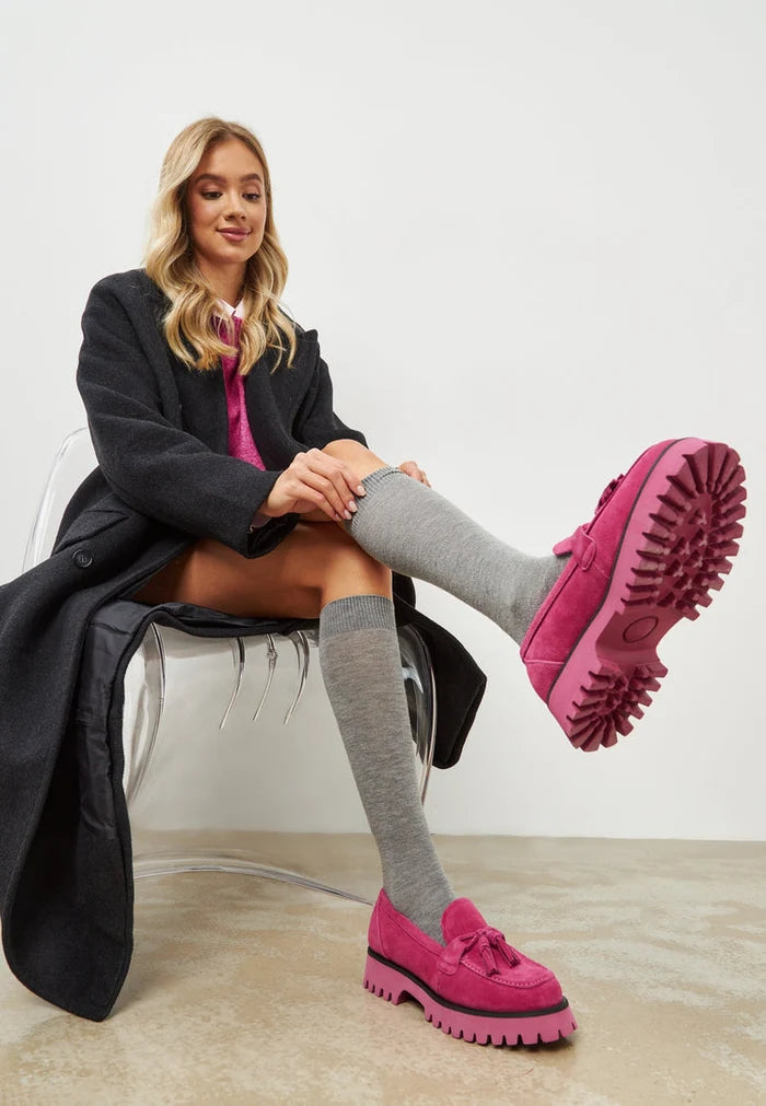 A trendy pair of fuchsia platform loafers designed by Ksenia, showcasing the latest in women's footwear fashion.