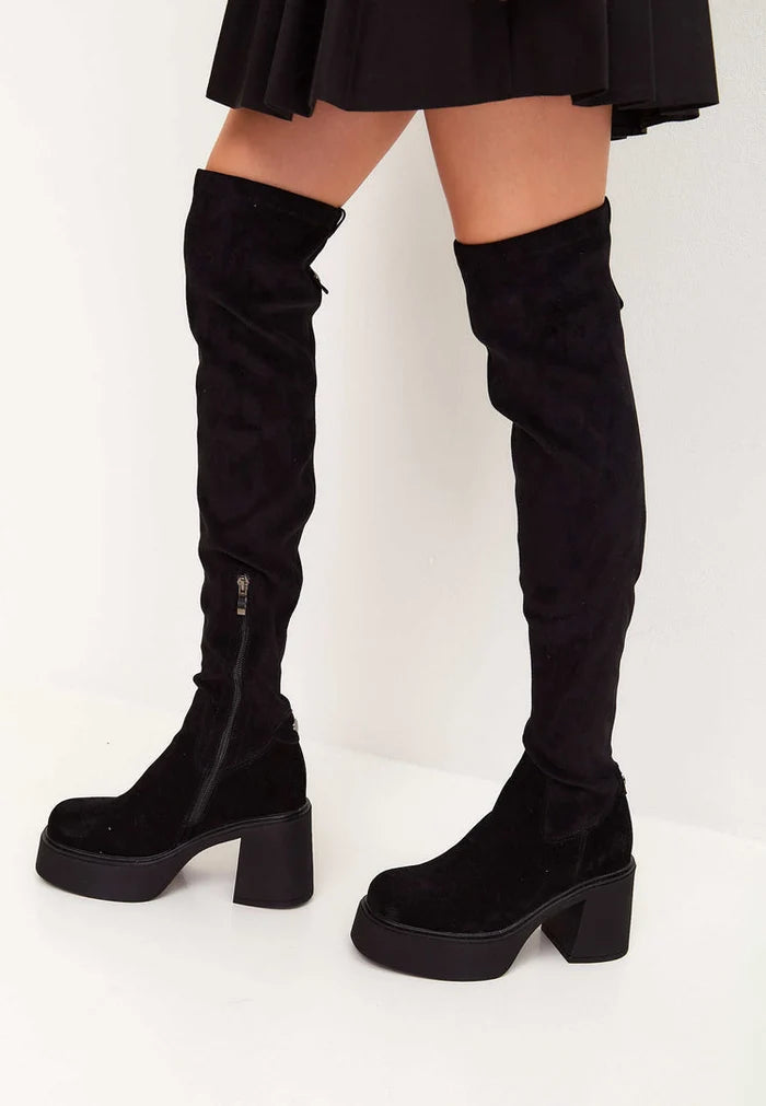 A trendy pair of over-the-knee black suede platform boots, perfect for ultimate style and fashion-forward looks.