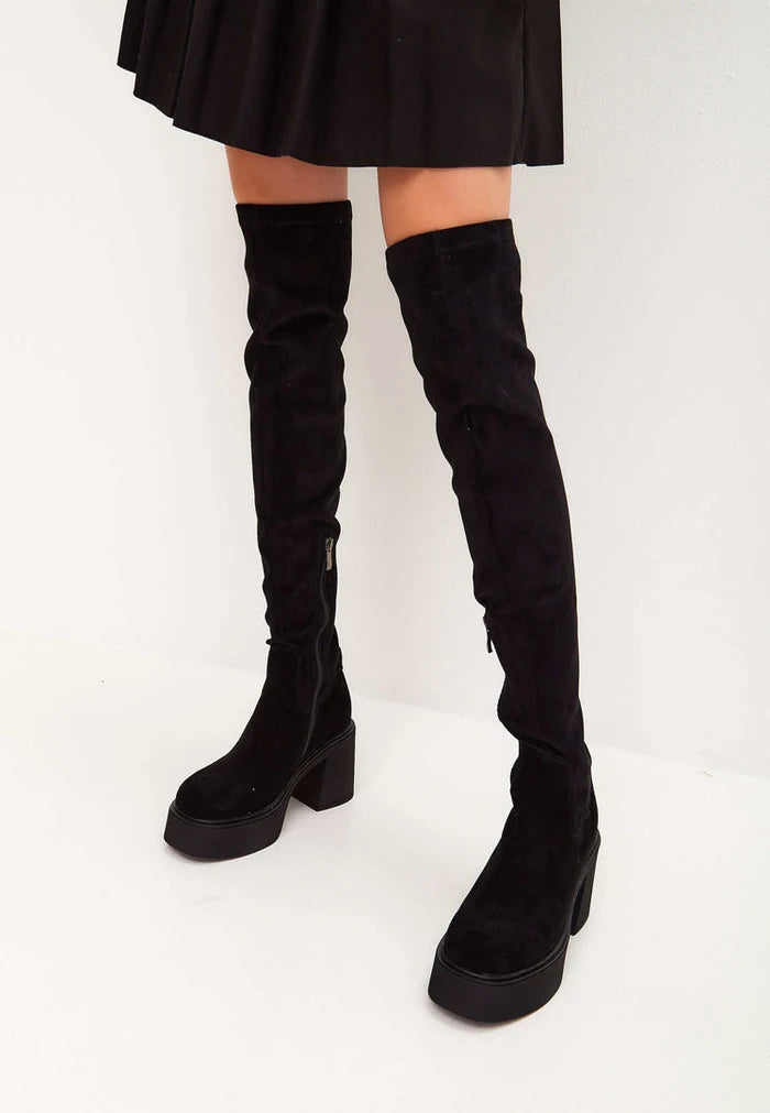 A stylish pair of black suede over-the-knee platform boots, perfect for a trendy fashion statement.