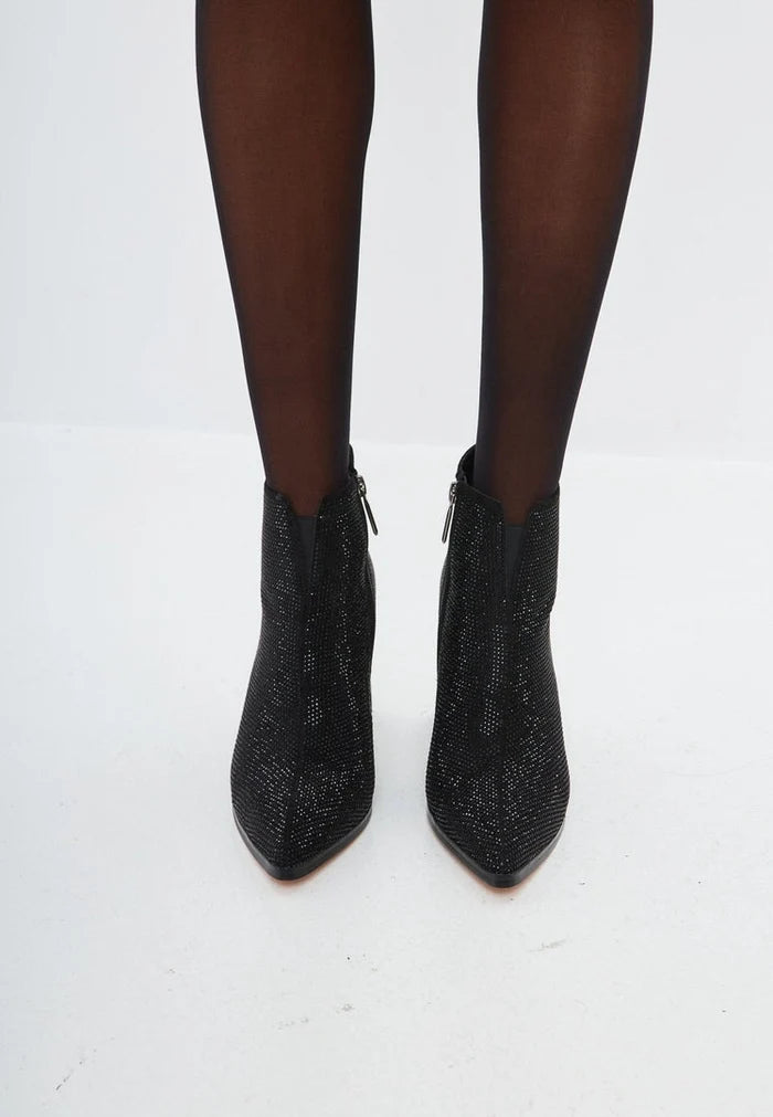 A fashionable pair of stylish black suede pointed toe ankle boots with a block heel, perfect for any outfit.