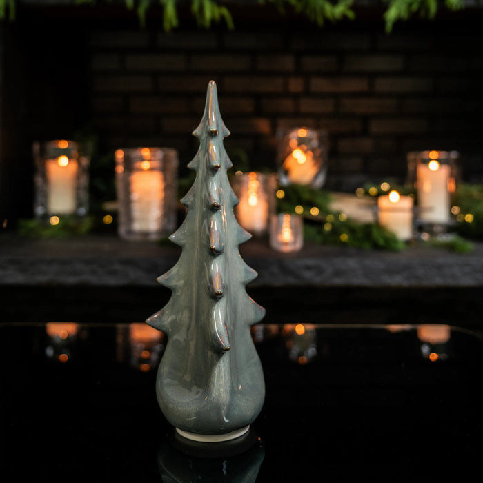 Gray ceramic evergreen tree figurine with glazed finish and textured branches.