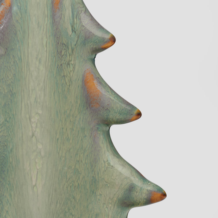 Ceramic vessel with moss green glaze and copper-brown accents, curved silhouette with protruding rounded nodules.
