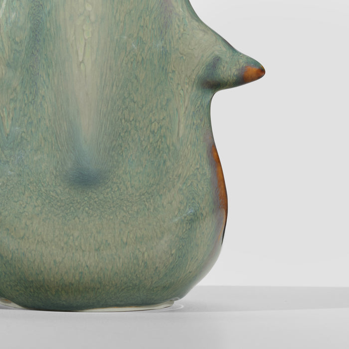 Moss green pottery vessel with organic, bulbous shape and rust-colored accents on spout and rim.