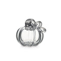 Clear glass pumpkin-shaped decorative object with textured stem and bow detail on top.