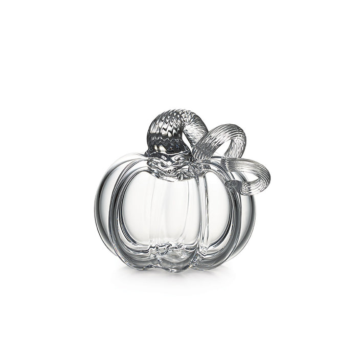 Clear glass pumpkin-shaped decorative object with textured stem and bow detail on top.