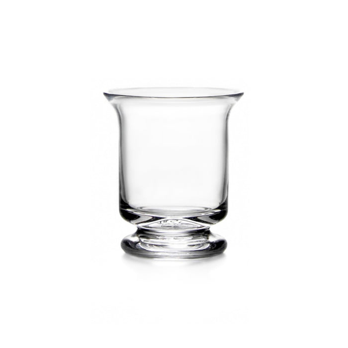 Clear glass hurricane vase with curved sides and pedestal base.