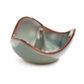 Gray ceramic ring holder with curved bowl shape, central post, and reddish-brown rim accent.