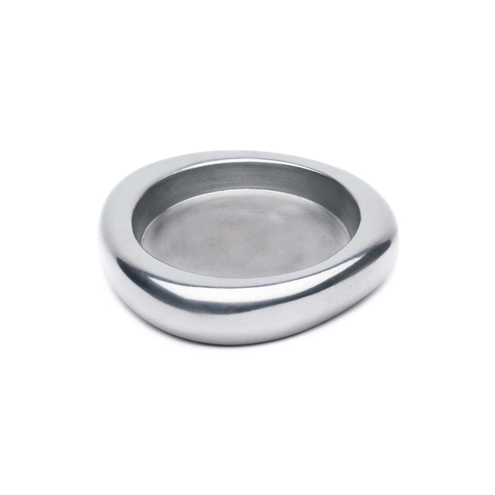 Polished silver wine coaster with smooth, curved oval shape and recessed center well.