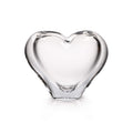 Clear glass vase in a heart shape with curved sides and flat bottom.