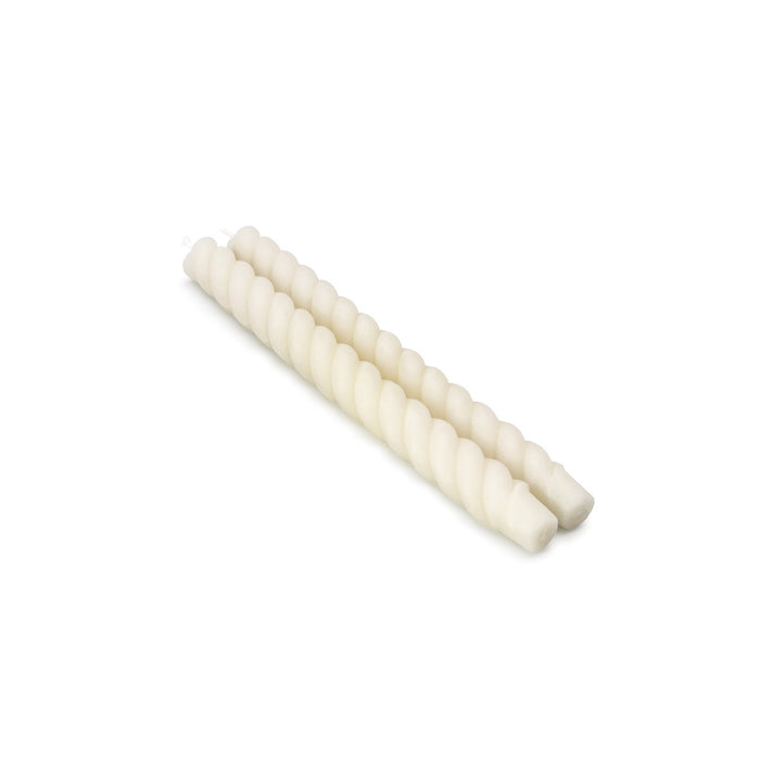Two cream-colored twisted taper candles with tapered ends arranged side by side.