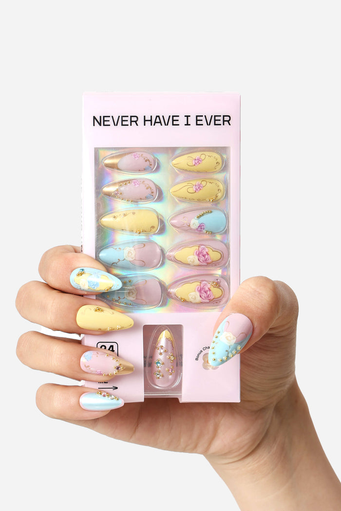 Rose Garden almond press-on nails featuring pastel colors and floral designs with gold accents.
