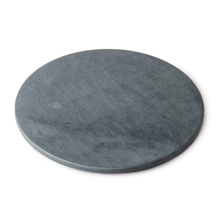 Round grey soapstone board with flat surface and slightly beveled edge.