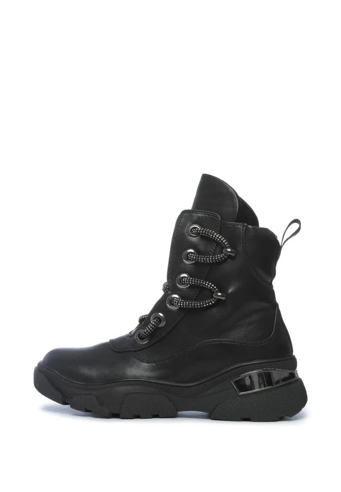 A pair of durable waterproof winter boots, perfect for cold weather conditions. These insulated lace-up boots are ideal for outdoor activities in the snow.