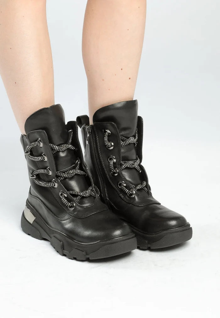 A pair of durable and waterproof winter boots, perfect for cold weather adventures.