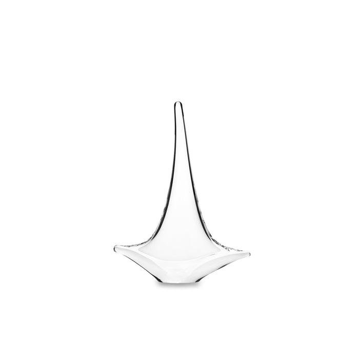 White glass sailboat sculpture with tall curved sail and wide base on white background.