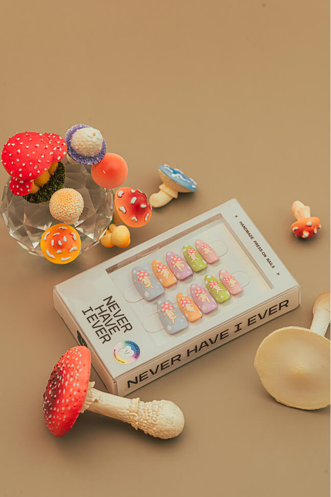 Set of Sakura Picnic by Veronica Chen press-on nails with mushroom-themed designs.