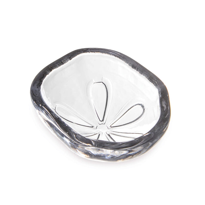 White ceramic bowl with dark grey rim and sand dollar relief pattern in center.
