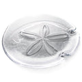 Clear glass platter with embossed sand dollar design and two curved handles on the sides.