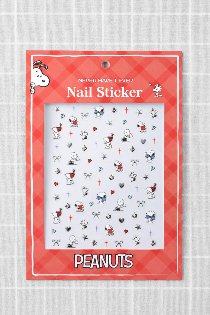 Peanuts nail stickers with Snoopy and Woodstock designs on a red checkered background.