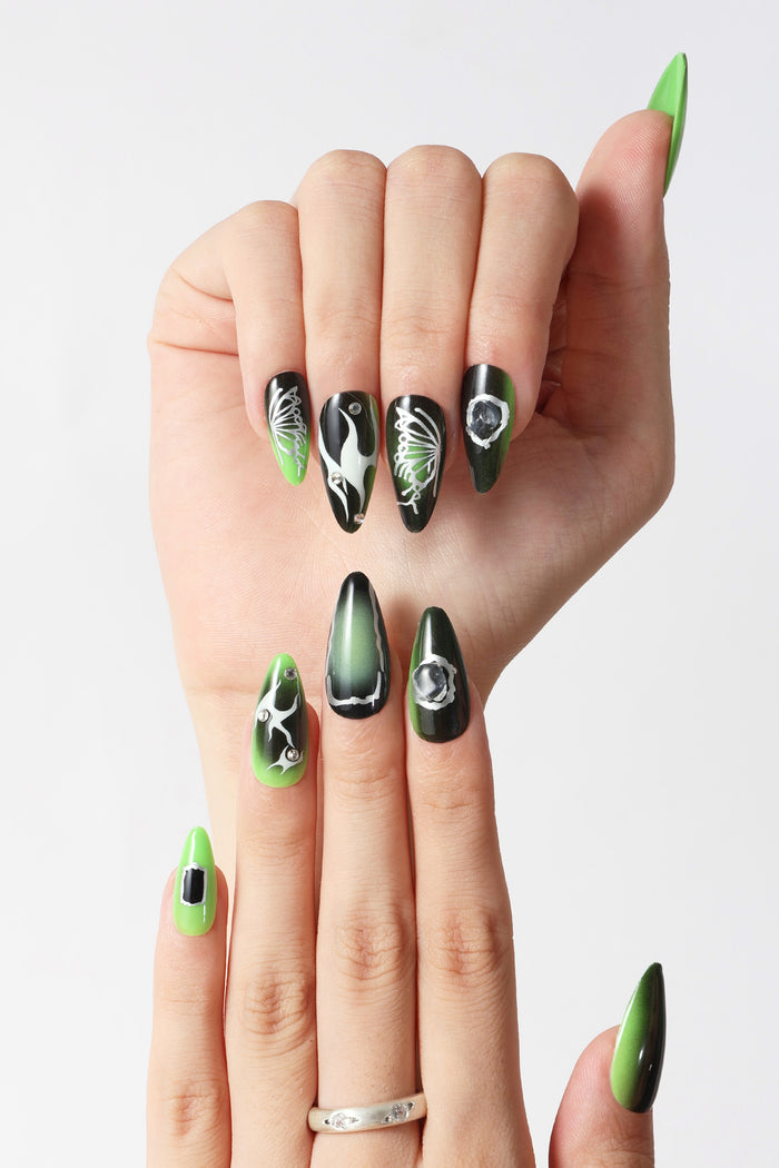 Stiletto press-on nails: green/black ombre, butterfly & flame designs, rhinestones.