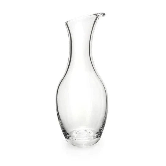 Clear glass carafe with curved sides and a pouring spout at the top.