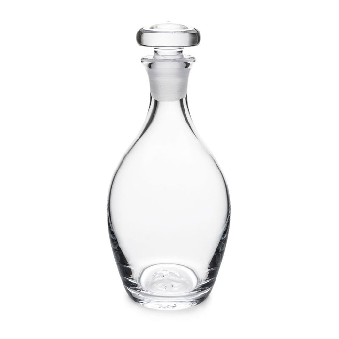 Clear glass decanter with rounded body, narrow neck, and matching glass stopper with flat top.