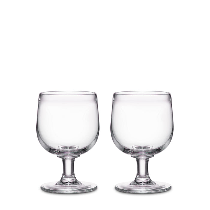 Two clear glass goblets with pedestal bases and rounded bowls.
