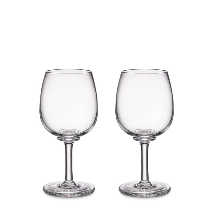 Two clear glass wine glasses with rounded bowls and stemmed bases.