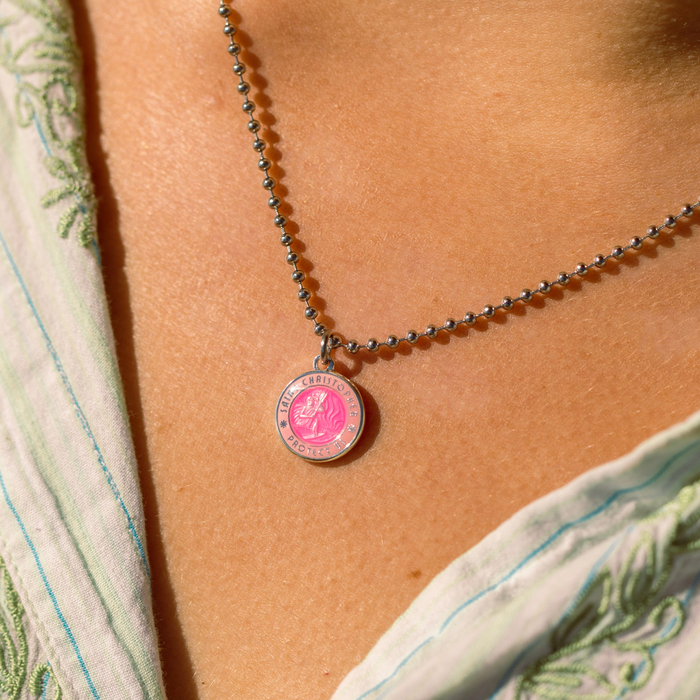 small fuchsia pink st. christopher close up