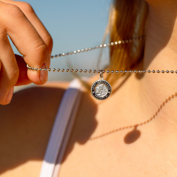 small silver black st. christopher close up