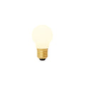 Matte porcelain spherical LED bulb with brass threaded base and black contact point, glowing warm white.