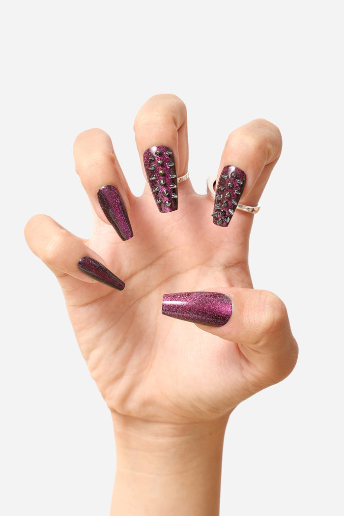 Spiked out coffin press-on nails in shimmering magenta with silver studs