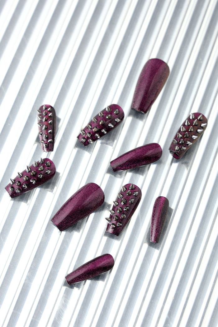 Spiked Out coffin press-on nails in deep wine glitter with silver studs