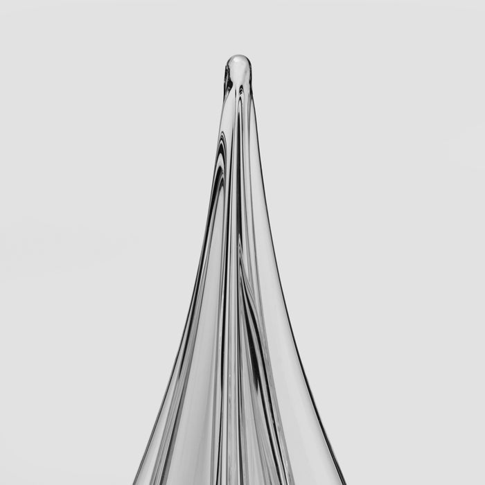 Tall cone-shaped object with vertical ridged lines tapering to a point at the top.