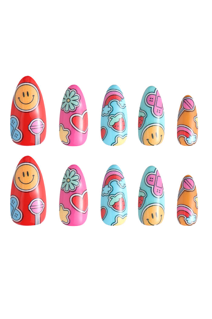Sticker Mania Mercedes Bazan press-on nails: smiley faces, rainbows, strawberries, lollipops.