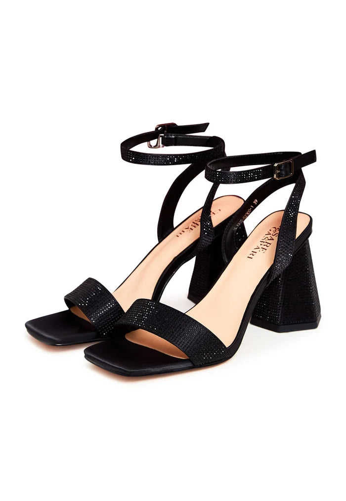 A stylish pair of black block heel strappy sandals with rhinestone detailing, perfect for women's footwear.