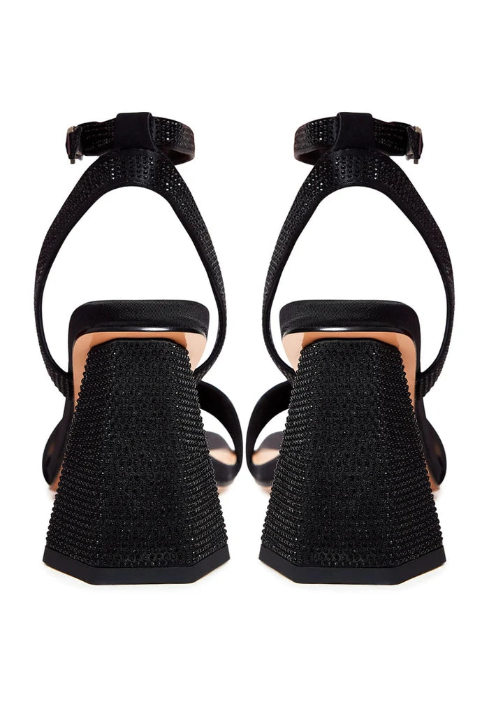 A stylish pair of black block heel strappy sandals with rhinestone embellishments, perfect for adding a touch of glamour to any outfit, ideal for women's footwear fashion.