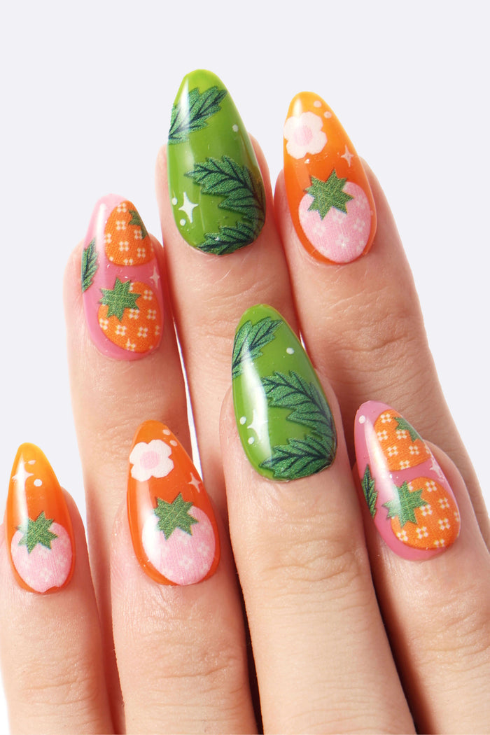 Strawberry Patch by Megan Roy press-on nails: pink with strawberries, green with leaves, orange with strawberries & flowers.