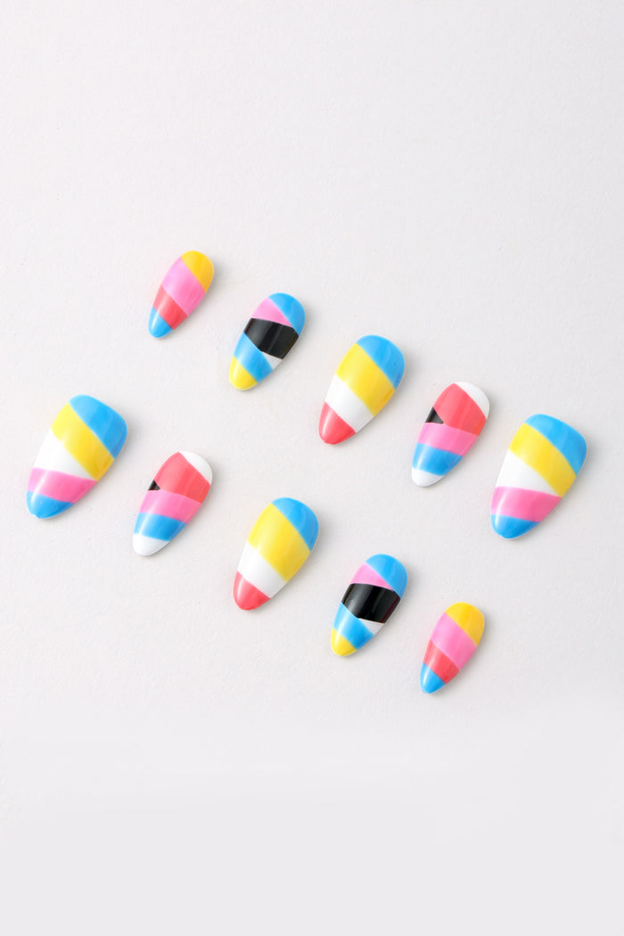 Striped Bliss press-on nails with pink, yellow, blue, white, and black stripes.