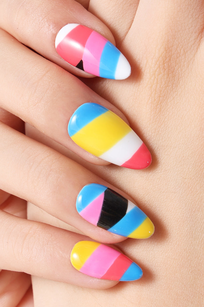 Almond-shaped press-on nails with bold pink, blue, yellow, white, and black stripes. Glossy finish.