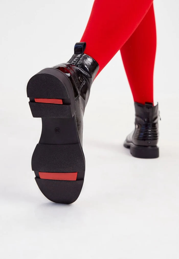 A pair of stylish Antonia patent black ankle boots - the perfect addition to any women's fashion footwear collection.